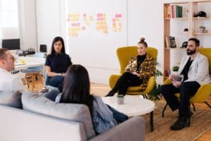 Employees sit in circle