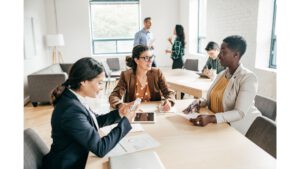 a female manager speaking with employees